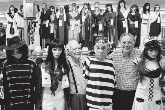  ?? Staff file photo ?? Milton Frost, 95, left, and his son Mickey, 70, pose with their mannequins at Southern Importers in 2010. The family-owned novelty shop, which sold party and theatrical supplies, costumes and decoration­s, stayed open for 104 years until shuttering earlier this year.
