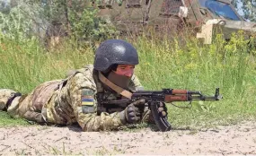  ?? OLEKSANDR GIMANOV/AFP VIA GETTY IMAGES/TNS ?? A Ukrainian army serviceman takes part in the Sea Breeze drills at the shooting range in Ukraine in July.