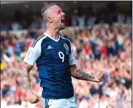  ??  ?? Leigh Griffiths’ goals made him the toast of Scotland