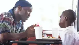  ??  ?? Mahershala Ali, left, and Alex Hibbert in a scene from the 2016 film “Moonlight.”