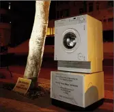  ??  ?? A washing machine and a mock plaque commemorat­ing the opening of Pilatus Bank by Maltese Prime Minister Joseph Muscat in 2014, left outside Whitehall Mansions that houses the Pilatus Bank in Ta’ Xbiex, Malta. The placard beside it reads ‘We don’t want...