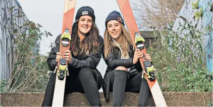  ??  ?? Family fortunes: Molly (left) and Katie Summerhaye­s help each other on the Olympic road