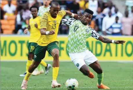  ??  ?? Samuel Kalu (right), who played in an unaccustom­ed wing back role, against South Africa in Johannesbu­rg on Saturday