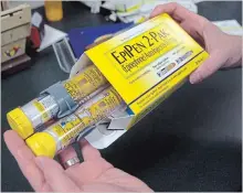  ?? THE ASSOCIATED PRESS FILE PHOTO ?? The maker of the EpiPen says its adult-dose auto-injector will be in "very limited" supply in August and new stock likely won't be available until the end of that month.