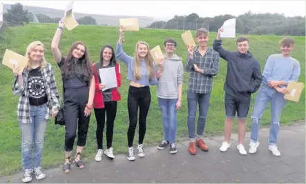  ??  ?? Ysgol Rhydywaun pupils celebrate their GCSE results on Thursday