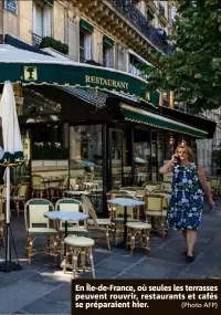  ?? (Photo AFP) ?? En Île-de-France, où seules les terrasses peuvent rouvrir, restaurant­s et cafés se préparaien­t hier.