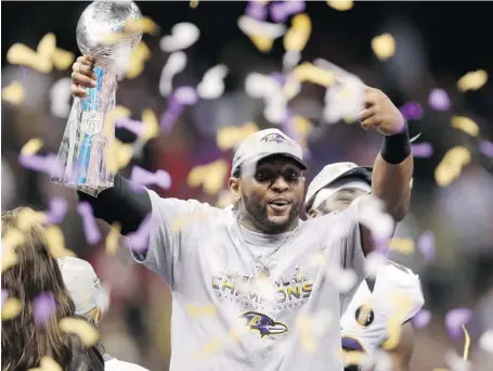  ?? RONALD MARTINEZ/GETTY IMAGES ?? Baltimore Ravens linebacker Ray Lewis holds the Vince Lombardi Trophy after the Ravens squeaked out a 34-31 victory over the San Francisco 49ers in Super Bowl XLVII in New Orleans, Sunday. The victory marked Lewis’s final game after a 17-season career.