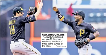 ?? Getty Images ?? SWASHBUCKL­ERS: Neil Walker (left) and Andrew McCutchen celebrate the Pirates’ three-game sweep of the Mets.