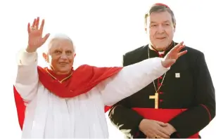  ?? (Reuters) ?? CARDINAL GEORGE PELL (right) looks on in 2008 as Pope Benedict XVI addresses a crowd of World Youth Day pilgrims before giving an address in Sydney.