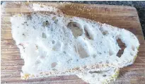  ?? CONTRIBUTE­D ?? Here's a slice of the latest loaf baked by food columnist Margaret Prouse, No-Knead Bread with Rosemary.