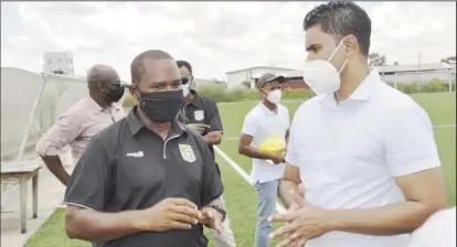  ??  ?? Guyana Football Federation president Wayne Forde and Minister of Sports Charles Ramson Jr., in dialogue at the National Training Facility Providence