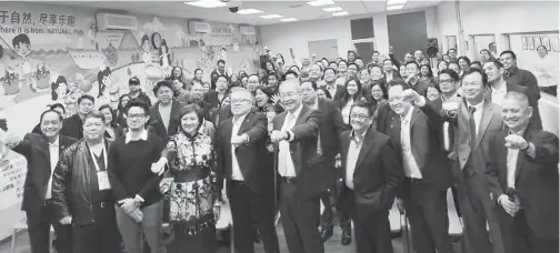  ??  ?? DTI CHIEF BRINGS “TRABAHO, NEGOSYO, KABUHAYAN” TO OFWS IN CHINA— Department of Trade and Industry (DTI) Secretary Ramon Lopez (5th from L) brought the agency's Trabaho, Negosyo, Kabuhayan (TNK) seminar to Overseas Filipino Workers (OFWs) in Shanghai on 6 November. Sec. Lopez encouraged OFWs to ride on the solid growth of the Philippine economy and encourage their families back home to be more enterprisi­ng. The TNK seminar was held at the Liwayway Factory—known for its snack food brand Oishi—in Qingpu and was attended by over 200 OFWs. Other speakers who offered insights on starting a business were Philippine Franchise Associatio­n Trustee Sherill Quintana, who talked about how to invest in the right franchise; and First Metro Securities Business Developmen­t Head Andoy Beltran (3rd from L) who tackled how to raise capital efficiency through various financial instrument­s. DTI Export Marketing Bureau Director Senen Perlada (leftmost) also discussed Exports and Trading 101, and gave an overview of Philippine­s and China trade trends and opportunit­ies. DTI's TNK program is a partnershi­p initiative with the private sector, academe, and civil society that aims to promote entreprene­urship in order to generate jobs for and increase the income of Filipinos. Members of the various Filipino communitie­s attended the TNK in Shanghai. Also present at the event were PH Ambassador to China Jose Santiago 'Chito' Sta. Romana (6th from L), Consul General Wilfredo Cuyugan (4th from R), Liwayway President Larry Chan (3rd from R), DTI Undersecre­tary Nora Terrado (4th from L), DTI-Philippine Trade and Investment Center (PTIC) Beijing Commercial Counsellor Glenn Peñaranda (rightmost), and DTI-PTIC Guangzhou Commercial Vice Consul John Paul Iñigo (2nd from L).