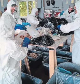  ?? SPECIAL TO THE EXAMINER ?? Fleming College students conduct a waste audit on behalf of the County of Peterborou­gh in this photo provided by the county.