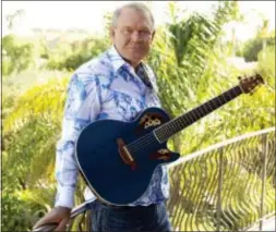  ??  ?? In this July 27, 2011, photo, musician Glen Campbell poses for a portrait in Malibu, Calif.