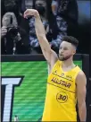  ?? BRYNN ANDERSON — THE AP ?? The Warriors’ Stephen Curry celebrates making a shot and beating Utah’s Mike Conley in the 3-point contest Sunday.