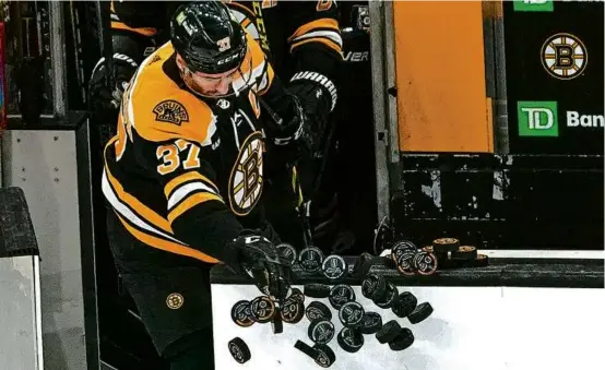  ?? BARRY CHIN/GLOBE STAFF ?? Will Sunday night’s Game 7 be the final time team captain Patrice Bergeron leads the Bruins out for pregame warm-ups?