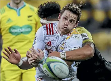  ?? PHOTO: GETTY IMAGES ?? Halfback Brad Weber was one of several Chiefs to get a good feel of Ardie Savea’s shoulder on Saturday.