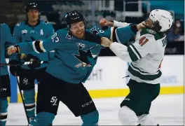  ?? NHAT V. MEYER — BAY AREA NEWS GROUP ?? The Sharks’ Jeffrey Viel (63) fights against the Wild’s Luke Johnson (41) in the first period at SAP Center in San Jose on Monday.