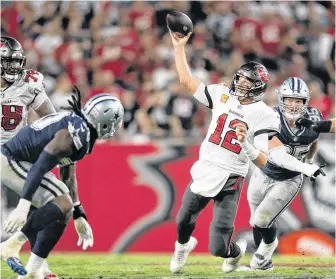  ?? USA TODAY SPORTS ?? Tampa Bay Buccaneers quarterbac­k Tom Brady (12) throws the ball against the Dallas Cowboys in the fourth quarter at Raymond James Stadium on Thursday night.