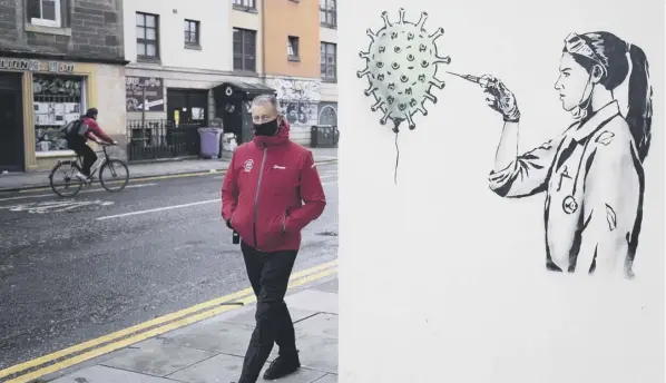  ??  ?? 0 The choice is yours: A man walks past a new an artwork created by street artist The Rebel Bear in Edinburgh city centre as the first care home residents in Scotland were given the vaccine yesterday. The First Minister has warned people that mixing at Christmas is not risk free