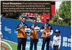  ??  ?? Proud Malaysians: (From left) Haziq Kamaruddin, Khairul Anuar Mohamad and Muhd Akmal Nor Hasrin posing with their medals after finishing third in the third leg of the Archery World Cup on Sunday.