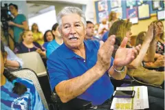  ?? PHOTOS BY CRAIG FRITZ/FOR THE NEW MEXICAN ?? A supporter of E.J. Martinez Elementary School, Jake Salazar, applauds a speaker Tuesday during public comments at the Santa Fe school board meeting.