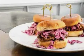  ?? Photos by Victoria Dearmond ?? Pulled pork sliders bring something new to the menu at Julep.