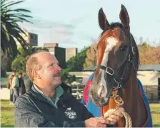  ??  ?? Trainer John Wheeler with racehorse Rough Habit.