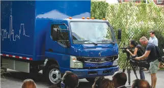  ??  ?? A NEW Daimler AG, FUSO battery-powered eCanter urban delivery truck is unveiled during a news conference in New York City, Sept. 14.