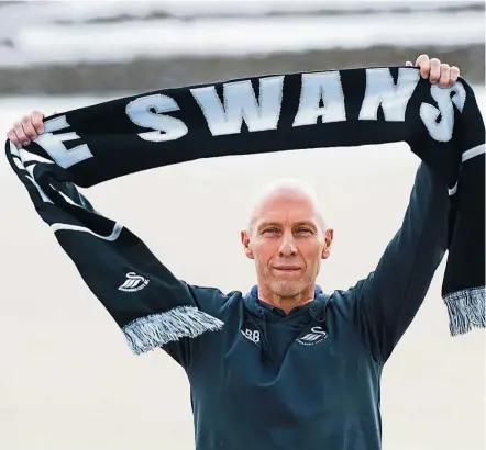  ??  ?? New chapter: New Swansea manager Bob Bradley posing for a photograph after a press conference in Swansea on Friday. Bradley is the first American to manage an English Premier League team. — AP