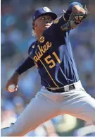  ?? ASSOCIATED PRESS ?? Brewers pitcher Freddy Peralta allowed three runs on two hits and recorded two strikeouts in 2 2/3 innings.