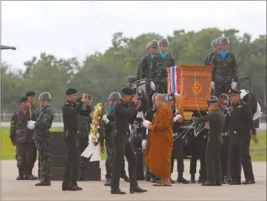  ?? The Associated Press ?? The body of Saman Gunan, a former Thai navy SEAL who died during an overnight mission, is carried during a repatriati­on and religious rites ceremony at Chiang Rai Airport in Mae Sai, Chiang Rai province, in northern Thailand on Friday.