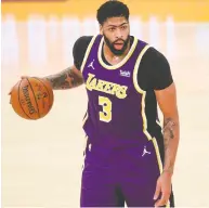 ?? MEG OLIPHANT / GETTY IMAGES ?? Los Angeles Lakers' Anthony Davis was to undergo an MRI Monday after leaving Sunday's game with a strain to his right Achilles'. He played just 14 minutes.