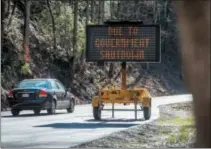  ?? ROBERT BERLIN/THE DAILY TIMES VIA AP ?? Nonprofits, businesses and state government­s nationwide are putting up money and volunteer hours in a battle to keep national parks safe and clean for visitors as the partial U.S. government shutdown lingers.