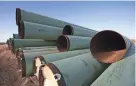  ?? REUTERS ?? Pipes for the Keystone XL pipeline lie in a field in Gascoyne, North Dakota, in 2013.