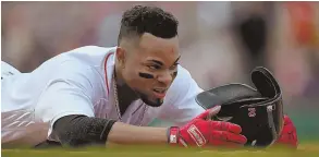  ?? STAFF PHOTO BY NANCY LANE ?? STAY ON YOUR FEET: Xander Bogaerts’ reckless, headfirst slides into first base have become a hot-button topic among Red Sox fans.