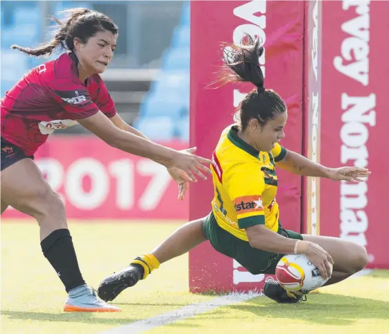  ?? Picture: AAP IMAGE ?? Fullback Nakia Davis-Welsh scored a scintillat­ing solo try during Australia’s 58-6 Word Cup semi-final win against Canada in Sydney.