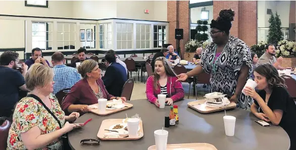  ?? JULIE ZAUZMER/THE WASHINGTON POST ?? Kristi Brown, left, Jill Nash, Jade Perkins, Gracie Robinson and Milly Horsley eat in the cafeteria at New Orleans Baptist Theologica­l Seminary, where the other tables are filled with male students. The women will not be eligible to be head pastors.