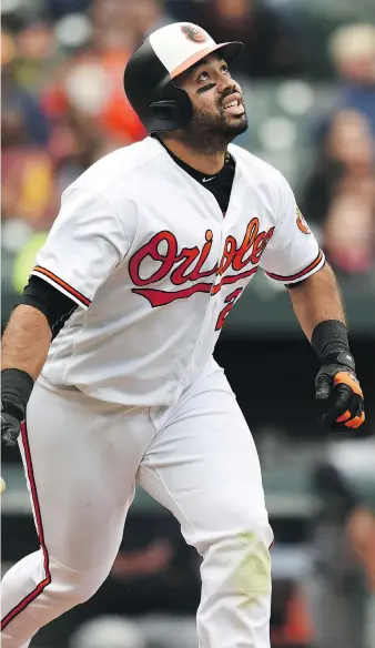  ?? THE ASSOCIATED PRESS ?? Baltimore’s Pedro Alvarez watches his solo blast leave the park in the eighth inning of Sunday’s game against the Tigers. Alvarez came off the bench to hit two home runs as the Orioles won 5-3.
