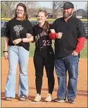  ?? ?? Senior Kayleigh Mathis, No. 10, was escorted by her parents, Larry and Casey Mathis.