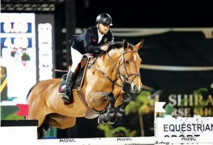  ??  ?? UAE’S Abdullah Al Marri, atop Sama Dubai, in action during the Longines Al Shira’aa Grand Prixat at the Al Shira’aa Internatio­nal Horse Show.