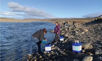  ?? Photograph: Canadian Press/Rex/Shuttersto­ck ?? Residents collect water from the Sylvia Grinnell River near Iqaluit. The city’s investigat­ion into its main drinking water source began last week after residents complained their tap water had a gasoline-like smell.