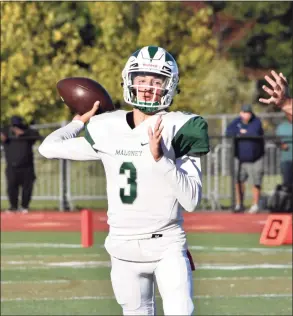 ?? Pete Paguaga / Hearst Connecticu­t Media ?? Maloney’s Angel Arce throws a pass against Middletown at Middletown high on Oct. 4, 2019.