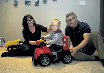  ?? JESSICA NYZNIK/ EXAMINER ?? Parents Kelly O’Dwyer-Manuel and Jamie Manuel play at home with 22-month-old Charlie on Wednesday. He is a mirco preemie, born before 28-weeks gestation. Friday is World Prematurit­y Day.