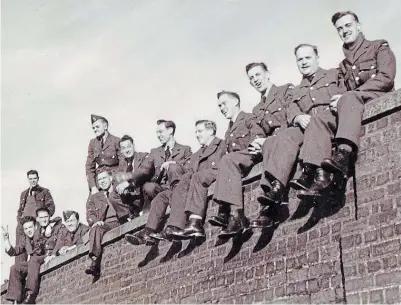  ?? CULLEY FAMILY PHOTO ?? Members of the RCAF Personnel Reception Centre Band on a railway bridge, with Harry Culley on the right. There was a lot of jubilation in Bournemout­h, where the band was stationed, at the end of the war.