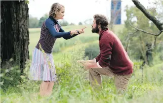  ?? PARAMOUNT PICTURES ?? Film fans have been sitting silently in theatres as actors Millicent Simmonds, left, and John Krasinski wow them with their strong performanc­es in the hit horror flick A Quiet Place.