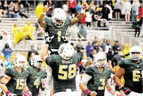  ?? Tony Gutierrez / Associated Press ?? No Baylor player is flying higher than dazzling wide receiver Corey Coleman, whose 20 touchdown receptions this season show he doesn’t need the boost provided by offensive tackle Spencer Drango to torment secondarie­s.