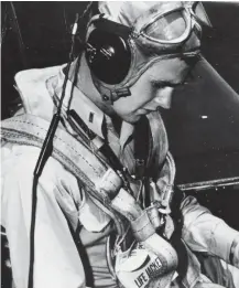  ?? NEWSCOM ?? AMERICAN HERO: Former President George H.W. Bush, above in an undated photo as a United States Navy pilot, was awarded the Distinguis­hed Flying Cross and three Air Medals for his service in the Pacific Theater during World War II.