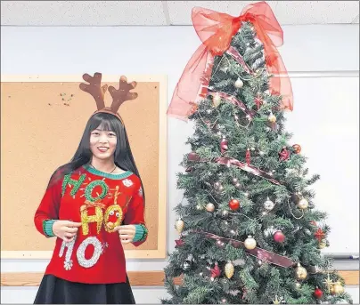  ?? SUBMITTED PHOTO ?? Lili Liu, a UPEI masters student from China, shows off her ugly Christmas sweater. She says that Christmas is similar to the Chinese New Year celebratio­n.