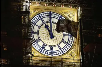  ?? GETTY IMAGES ?? TIME TO GO: Big Ben shows 11 p.m. on Thursday night, 24 hours before the United Kingdom officially parts with the European Union